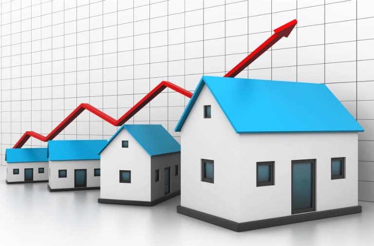 Rising real estate trend concept with buy-to-let strategy houses and an upward arrow.